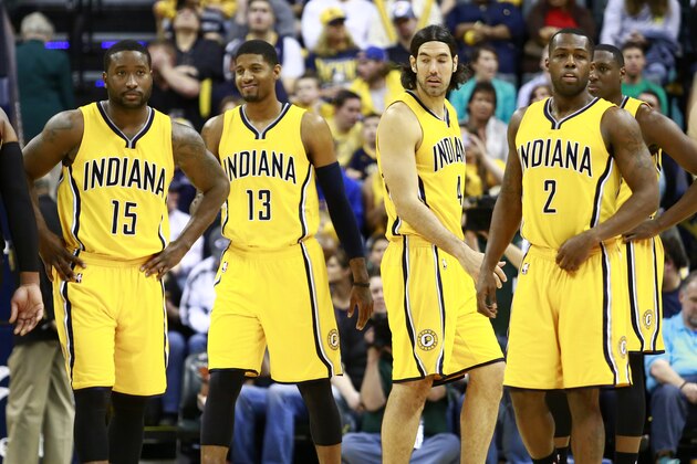 Indiana Pacers forward Paul George (13) stands on the court with Pacers Donald Sloan (15), Luis Scola and Rodney Stuckey (2) against the Miami Heat in the second half of an NBA basketball game, Sunday, April 5, 2015, in Indianapolis. Indiana won 112-89. (AP Photo/R Brent Smith)
