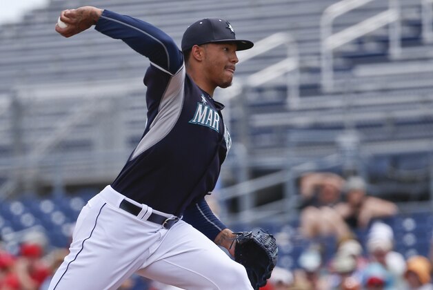 Seattle Mariners starting pitcher Taijuan Walker pitches against the Los Angeles Angels in the first inning of a spring training baseball game Monday, March 30, 2015, in Peoria, Ariz.  (AP Photo/Lenny Ignelzi)