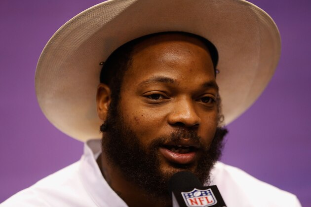 PHOENIX, AZ - JANUARY 27:  Michael Bennett #72 of the Seattle Seahawks addresses the media at Super Bowl XLIX Media Day Fueled by Gatorade inside U.S. Airways Center on January 27, 2015 in Phoenix, Arizona.  (Photo by Christian Petersen/Getty Images)