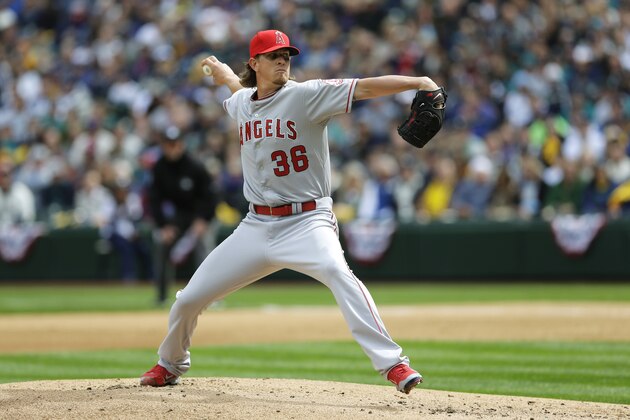 Los Angeles Angels starting pitcher Jered Weaver throws in the first inning of an opening day baseball game against the Seattle Mariners, Monday, April 6, 2015, in Seattle. (AP Photo/Ted S. Warren)
