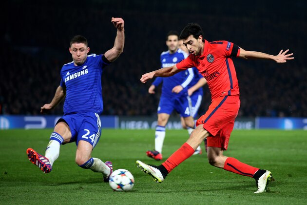 LONDON, ENGLAND - MARCH 11:  Javier Pastore of PSG takes a shot on goal past Gary Cahill of Chelsea during the UEFA Champions League Round of 16, second leg match between Chelsea and Paris Saint-Germain at Stamford Bridge on March 11, 2015 in London, England.  (Photo by Paul Gilham/Getty Images)