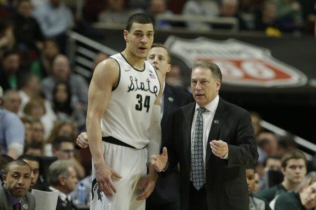 Michigan State's head coach Tom Izzo talks with Gavin Schilling in the second half of an NCAA college basketball game in the quarterfinals of the Big Ten Conference tournament in Chicago, Friday, March 13, 2015. (AP Photo/Nam Y. Huh)