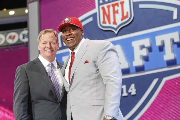 USC center Marcus Martin poses for photos with NFL commissioner Roger Goodell after being selected as the 70th pick by the San Francisco 49ers in the third round of the 2014 NFL Draft, Friday, May 9, 2014, in New York. (AP Photo/Jason DeCrow)