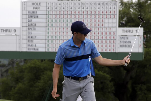 Jordan Spieth watches his putt on the 18th green during the first round of the Masters golf tournament Thursday, April 9, 2015, in Augusta, Ga. (AP Photo/Chris Carlson)