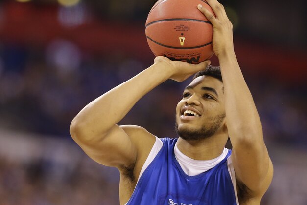 Kentucky's Karl-Anthony Towns shoots during a practice session for the NCAA Final Four tournament college basketball semifinal game Friday, April 3, 2015, in Indianapolis. Kentucky plays Wisconsin on Saturday. (AP Photo/Michael Conroy)
