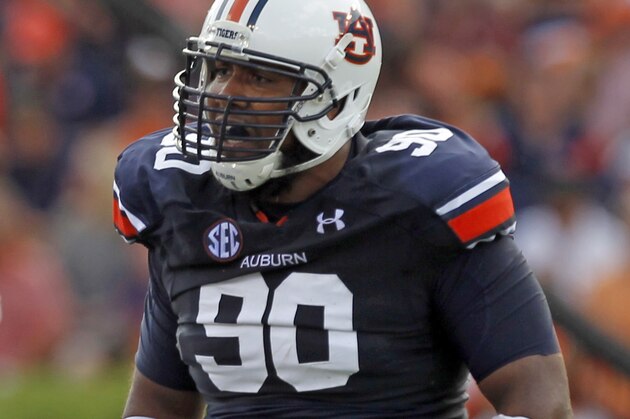 Auburn defensive lineman Gabe Wright (90) gets ready for a play during the first half of an NCAA college football game against Arkansas on Saturday, Aug. 30, 2014, in Auburn, Ala. (AP Photo/Butch Dill)