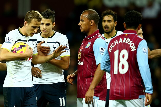 BIRMINGHAM, ENGLAND - NOVEMBER 02:  Harry Kane of Spurs keeps hold of the ball from team mate Erik Lamela to take the match winning freekick during the Barclays Premier League match between Aston Villa and Tottenham Hotspur at Villa Park on November 2, 2014 in Birmingham, England.  (Photo by Richard Heathcote/Getty Images)