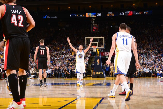 OAKLAND, CA -APRIL 9: Stephen Curry #30 of the Golden State Warriors celebrates after breaking the record for the most threes made in a season while facing the Portland Trail Blazers on April 9, 2015 at Oracle Arena in Oakland, California. NOTE TO USER: User expressly acknowledges and agrees that, by downloading and or using this photograph, user is consenting to the terms and conditions of Getty Images License Agreement. Mandatory Copyright Notice: Copyright 2015 NBAE (Photo by Noah Graham/NBAE via Getty Images)