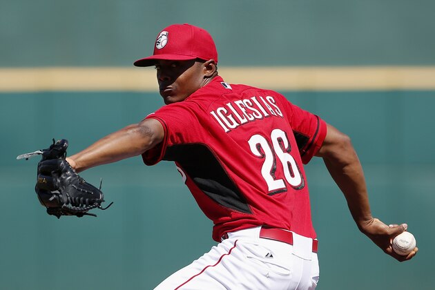 Cincinnati Reds' Raisel Iglesias warms up prior to the second inning of a spring training baseball game against the San Francisco Giants Monday, March 16, 2015, in Goodyear, Ariz. (AP Photo/Ross D. Franklin)