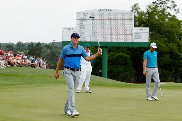 AUGUSTA, GA - APRIL 09:  Jordan Spieth of the United States celebrates a birdie on the 18th green for an eight-under par 64 during the first round of the 2015 Masters Tournament at Augusta National Golf Club on April 9, 2015 in Augusta, Georgia.  (Photo by Ezra Shaw/Getty Images)