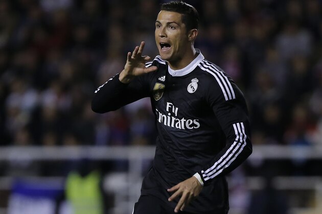 Real's Cristiano Ronaldo celebrates his goal during a Spanish La Liga soccer match between Rayo Vallecano and Real Madrid at the Vallecas stadium in Madrid, Spain, Wednesday, April 8, 2015. (AP Photo/Andres Kudacki)