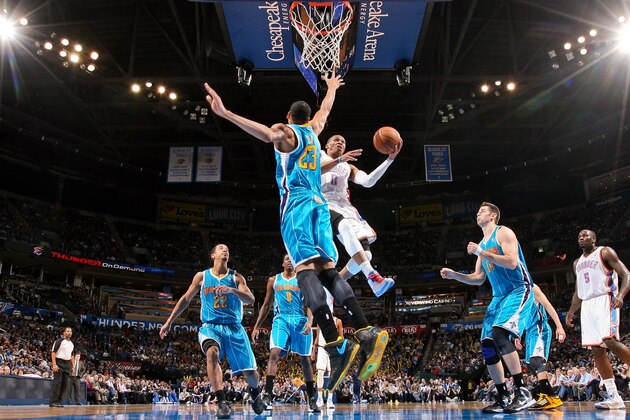OKLAHOMA CITY, OK - DECEMBER 12: Russell Westbrook #0 of the Oklahoma City Thunder drives to the basket against Anthony Davis #23 of the New Orleans Hornets on December 12, 2012 at the Chesapeake Energy Arena in Oklahoma City, Oklahoma. NOTE TO USER: User expressly acknowledges and agrees that, by downloading and or using this photograph, user is consenting to the terms and conditions of the Getty Images License Agreement. Mandatory Copyright Notice: Copyright 2012 NBAE (Photo by Layne Murdoch/NBAE via Getty Images)
