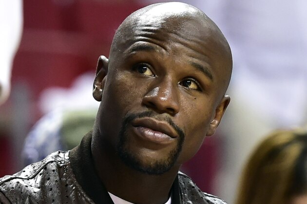 Jun 12, 2014; Miami, FL, USA; Professional boxer Floyd Mayweather Jr. attends game four of the 2014 NBA Finals between the Miami Heat and the San Antonio Spurs at American Airlines Arena. Mandatory Credit: Bob Donnan-USA TODAY Sports