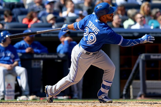 NEW YORK, NY - APRIL 06:  Devon Travis #29 of the Toronto Blue Jays hits a solo home run in the seventh inning against the New York Yankees during Opening Day on April 6, 2015 at Yankee Stadium in the Bronx borough of New York City.  (Photo by Elsa/Getty Images)