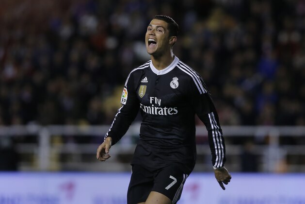 Real's Cristiano Ronaldo, left, celebrates his goal during a Spanish La Liga soccer match between Rayo Vallecano and Real Madrid at the Vallecas stadium in Madrid, Spain, Wednesday, April 8, 2015. (AP Photo/Andres Kudacki)