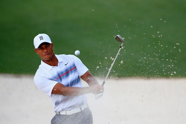 AUGUSTA, GA - APRIL 09:  Tiger Woods of the United States plays a bunker shot on the tenth hole during the first round of the 2015 Masters Tournament at Augusta National Golf Club on April 9, 2015 in Augusta, Georgia.  (Photo by Jamie Squire/Getty Images)