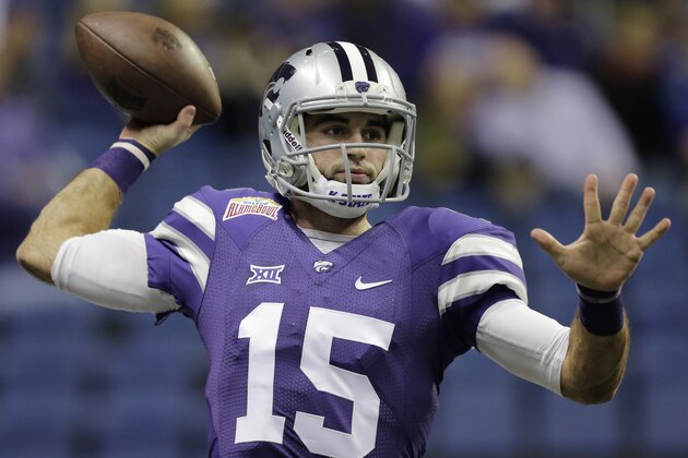 Kansas State’s Jake Waters (15) prepares prior to the Alamo Bowl NCAA college football game against UCLA, Friday, Jan. 2, 2015, in San Antonio. (AP Photo/Eric Gay)