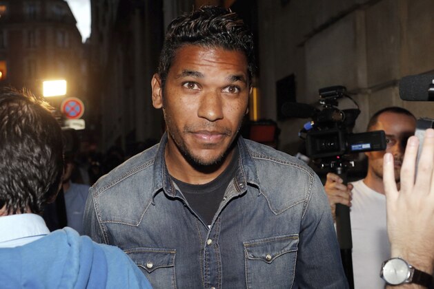 Brazilian striker Brandao leaves the French league disciplinary hearing, in Paris, Thursday, Sept. 18, 2014. Brandao attends a French league disciplinary hearing for headbutting Paris Saint-Germain midfielder Thiago Motta and breaking his nose after a match between PSG and Bastia last month. He has already been provisionally suspended but could face a lengthy ban. (AP Photo/Thibault Camus)