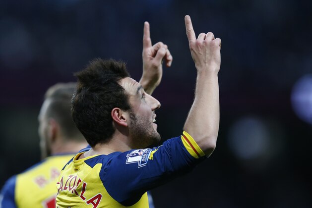 Arsenal's Santi Cazorla celebrates after scoring the opening goal of the game from the penalty spot during the English Premier League soccer match between Manchester City and Arsenal at the Etihad Stadium, Manchester, England, Sunday Jan. 18, 2015. (AP Photo/Jon Super)