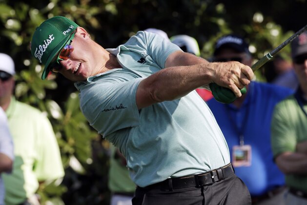 Charley Hoffman tees off on the ninth hole during the first round of the Masters golf tournament Thursday, April 9, 2015, in Augusta, Ga. (AP Photo/Charlie Riedel)