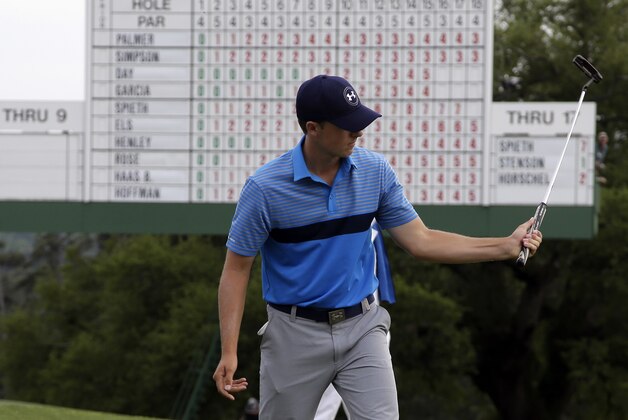 Jordan Spieth watches his putt on the 18th green during the first round of the Masters golf tournament Thursday, April 9, 2015, in Augusta, Ga. (AP Photo/Chris Carlson)