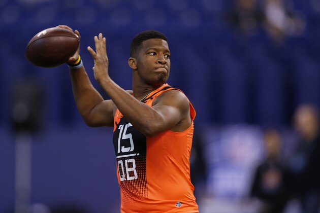Florida State quarterback Jameis Winston runs a drill at the NFL football scouting combine in Indianapolis, Saturday, Feb. 21, 2015. (AP Photo/Julio Cortez)