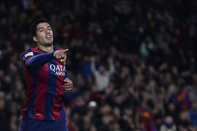 FC Barcelona's Luis Suarez, from Uruguay, celebrates after scoring against Almeria during a Spanish La Liga soccer match at the Camp Nou stadium in Barcelona, Spain, Wednesday, April 8, 2015. (AP Photo/Manu Fernandez)