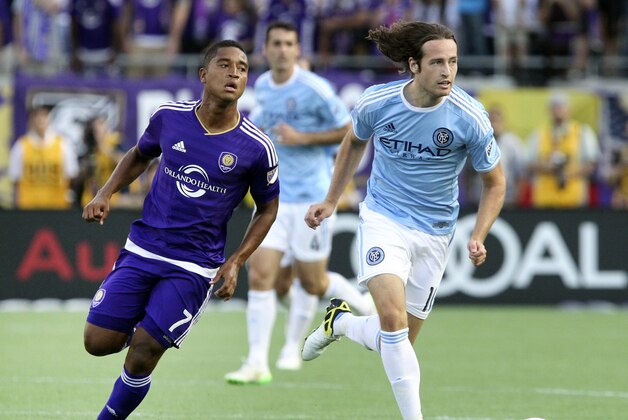 Mar 8, 2015; Orlando, FL, USA; Orlando City FC midfielder Cristian Higuita (7) chases New York City FC midfielder Mix Diskerud (10) during the second half of an MLS soccer match at Orlando Citrus Bowl Stadium. The Orlando City FC and New York City FC tied 1-1. Mandatory Credit: Reinhold Matay-USA TODAY Sports