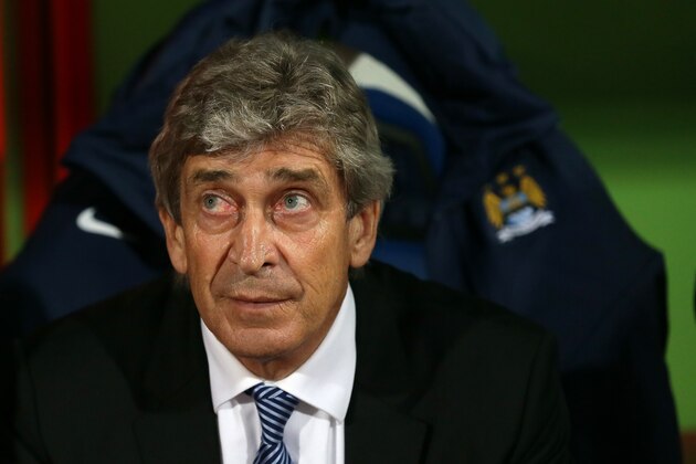 Manchester City manager Manuel Pellegrini looks up at the stands ahead of the English Premier League soccer match between Crystal Palace and Manchester City at Selhurst Park Stadium, London, Monday, April 6, 2015. (AP Photo/Tim Ireland)