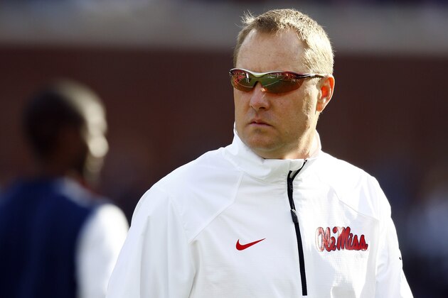 Mississippi football coach Hugh Freeze looks down field toward Mississippi State as they warm up prior to their NCAA college football game in Oxford, Miss., Saturday, Nov. 29, 2014. (AP Photo/Rogelio V. Solis)