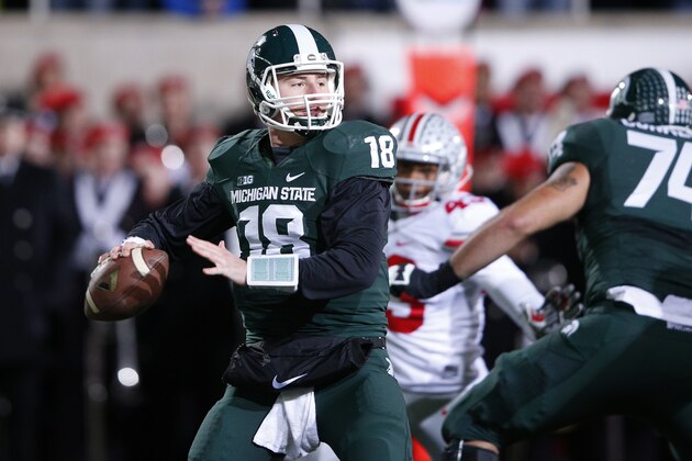 EAST LANSING, MI - NOVEMBER 8: Connor Cook #18 of the Michigan State Spartans looks to pass the ball in the first half of the game against the Ohio State Buckeyes at Spartan Stadium on November 8, 2014 in East Lansing, Michigan. (Photo by Joe Robbins/Getty Images)
