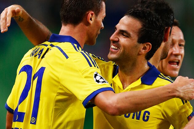 LISBON, PORTUGAL - SEPTEMBER 30:  Nemanja Matic of Chelsea (21) celebrates with team mate Cesc Fabregas as he scores their first goal  during the UEFA Champions League Group G match between Sporting Clube de Portugal and Chelsea FC at Estadio Jose Alvalade on September 30, 2014 in Lisbon, Portugal.  (Photo by Julian Finney/Getty Images)