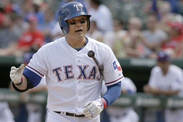 Texas Rangers Shin-Soo Choo, of South Korea questions a third strike called on him during the baseball game against the Texas Rangers in Arlington, Texas, Sunday, June 29, 2014. (AP Photo/LM Otero)