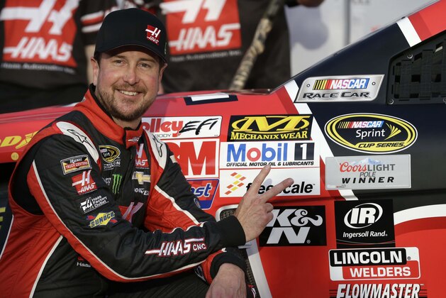 Kurt Busch poses for photos after taking the pole position during qualifying for the NASCAR Sprint Cup auto race at Texas Motor Speedway in Fort Worth, Texas, Friday, April 10, 2015. (AP Photo/Tim Sharp) Kurt Busch poses for photos after taking the pole position during qualifying for the NASCAR Sprint Cup auto race at Texas Motor Speedway in Fort Worth, Texas, Friday, April 10, 2015. (AP Photo/Tim Sharp)