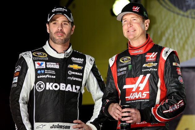 DAYTONA BEACH, FL - FEBRUARY 15:  Jimmie Johnson, driver of the #48 Lowe's/Kobalt Tools Chevrolet, and Kurt Busch, driver of the #41 Haas Automation Chevrolet, are introduced prior to the NASCAR Sprint Cup Series Sprint Unlimited at Daytona International Speedway on February 15, 2014 in Daytona Beach, Florida.  (Photo by Todd Warshaw/Getty Images)