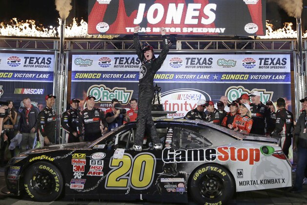 Erik Jones (20) celebrates after winning the NASCAR Xfinity series auto race at Texas Motor Speedway in Fort Worth, Texas, Friday, April 10, 2015. (AP Photo/Tim Sharp)