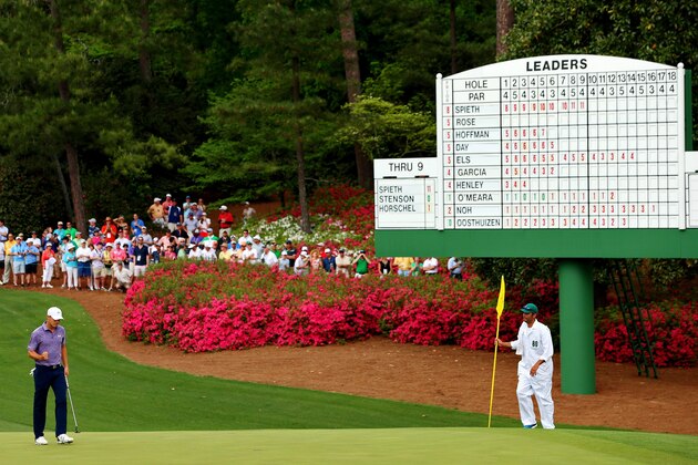 AUGUSTA, GA - APRIL 10:  Jordan Spieth of the United States makes birdie on the tenth hole as his caddie Michael Greller looks on during the second round of the 2015 Masters Tournament at Augusta National Golf Club on April 10, 2015 in Augusta, Georgia.  (Photo by Andrew Redington/Getty Images)