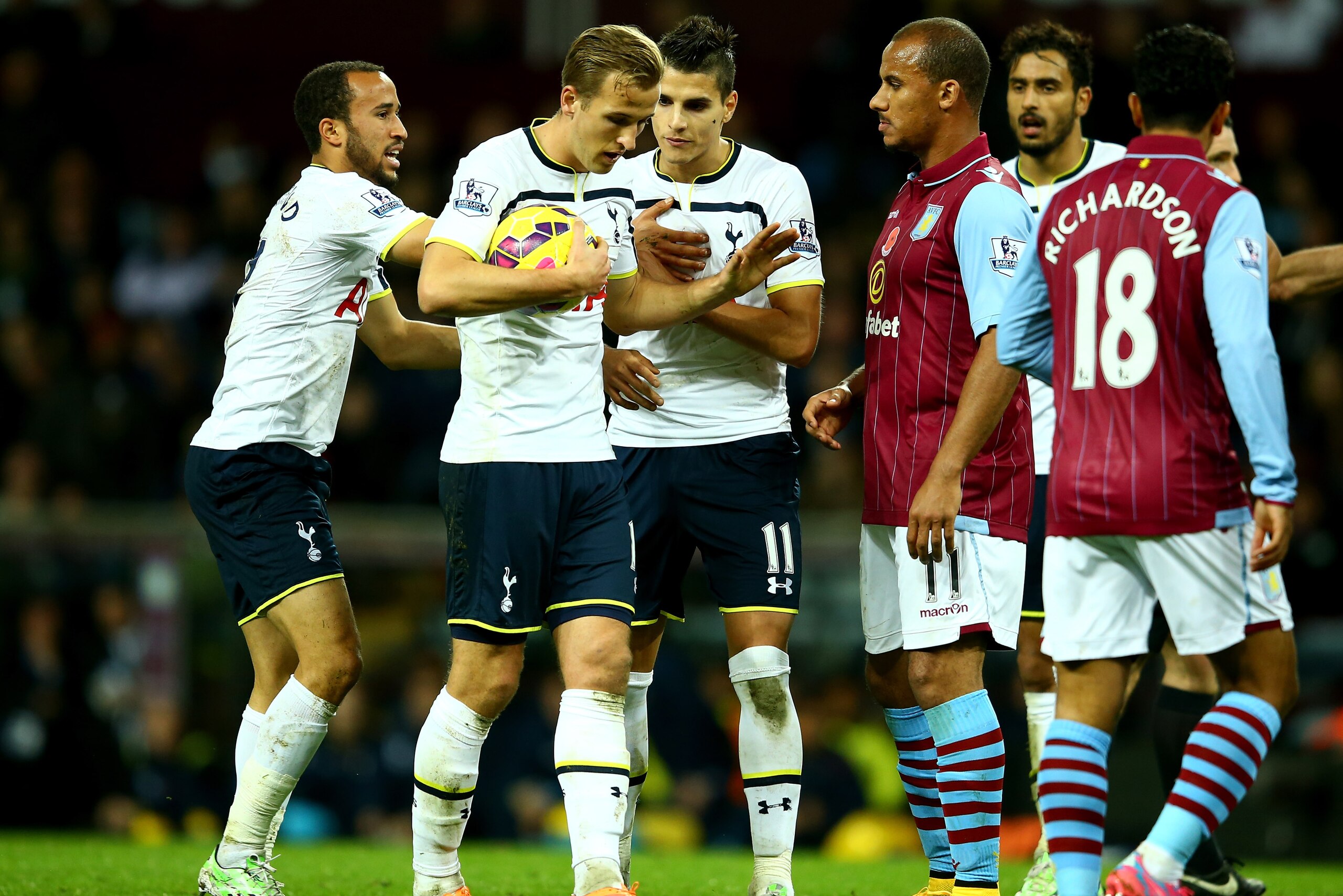 BIRMINGHAM, ENGLAND - NOVEMBER 02:  Harry Kane of Spurs keeps hold of the ball from team mate Erik Lamela to take the match winning freekick during the Barclays Premier League match between Aston Villa and Tottenham Hotspur at Villa Park on November 2, 2014 in Birmingham, England.  (Photo by Richard Heathcote/Getty Images)