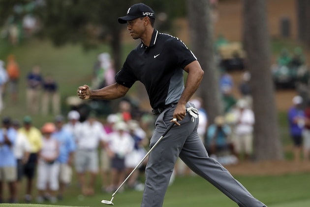 Tiger Woods pumps his fist after a birdie on the seventh hole during the second round of the Masters golf tournament Friday, April 10, 2015, in Augusta, Ga. (AP Photo/Matt Slocum)