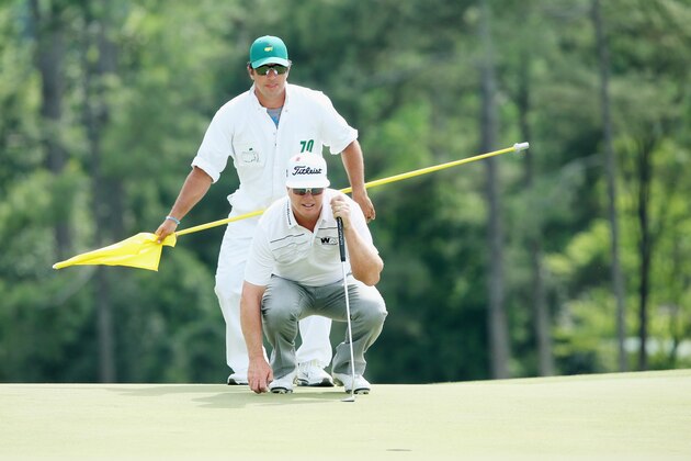 AUGUSTA, GA - APRIL 10:  Charley Hoffman of the United States waits on the 18th green with his caddie Brett Waldman during the second round of the 2015 Masters Tournament at Augusta National Golf Club on April 10, 2015 in Augusta, Georgia.  (Photo by Andrew Redington/Getty Images)