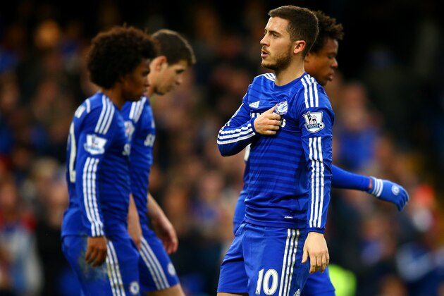 LONDON, ENGLAND - APRIL 04:  Eden Hazard of Chelsea celebrates with team-mates after scoring the opening goal from the penalty spot during the Barclays Premier League match between Chelsea and Stoke City at Stamford Bridge on April 4, 2015 in London, England.  (Photo by Richard Heathcote/Getty Images)