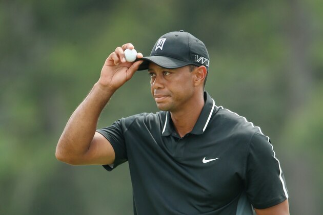 AUGUSTA, GA - APRIL 10:  Tiger Woods of the United States waves to the gallery on the 18th green during the second round of the 2015 Masters Tournament at Augusta National Golf Club on April 10, 2015 in Augusta, Georgia.  (Photo by Andrew Redington/Getty Images)