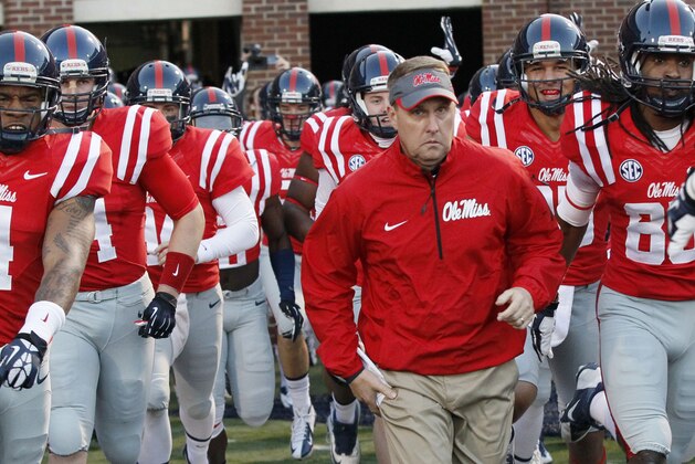 FILE - In this Oct. 19, 2013, file photo, Mississippi football coach Hugh Freeze leads his team to the field prior to their NCAA college football game against LSU  in Oxford, Miss. Mississippi has aspirations of competing for SEC titles. No. 11 Ole Miss (4-0, 1-0) plays No. 3 Alabama (4-0, 1-0) on Saturday, Oct. 4, 2014,  in its biggest home game in more than a decade.  (AP Photo/Rogelio V. Solis, File)