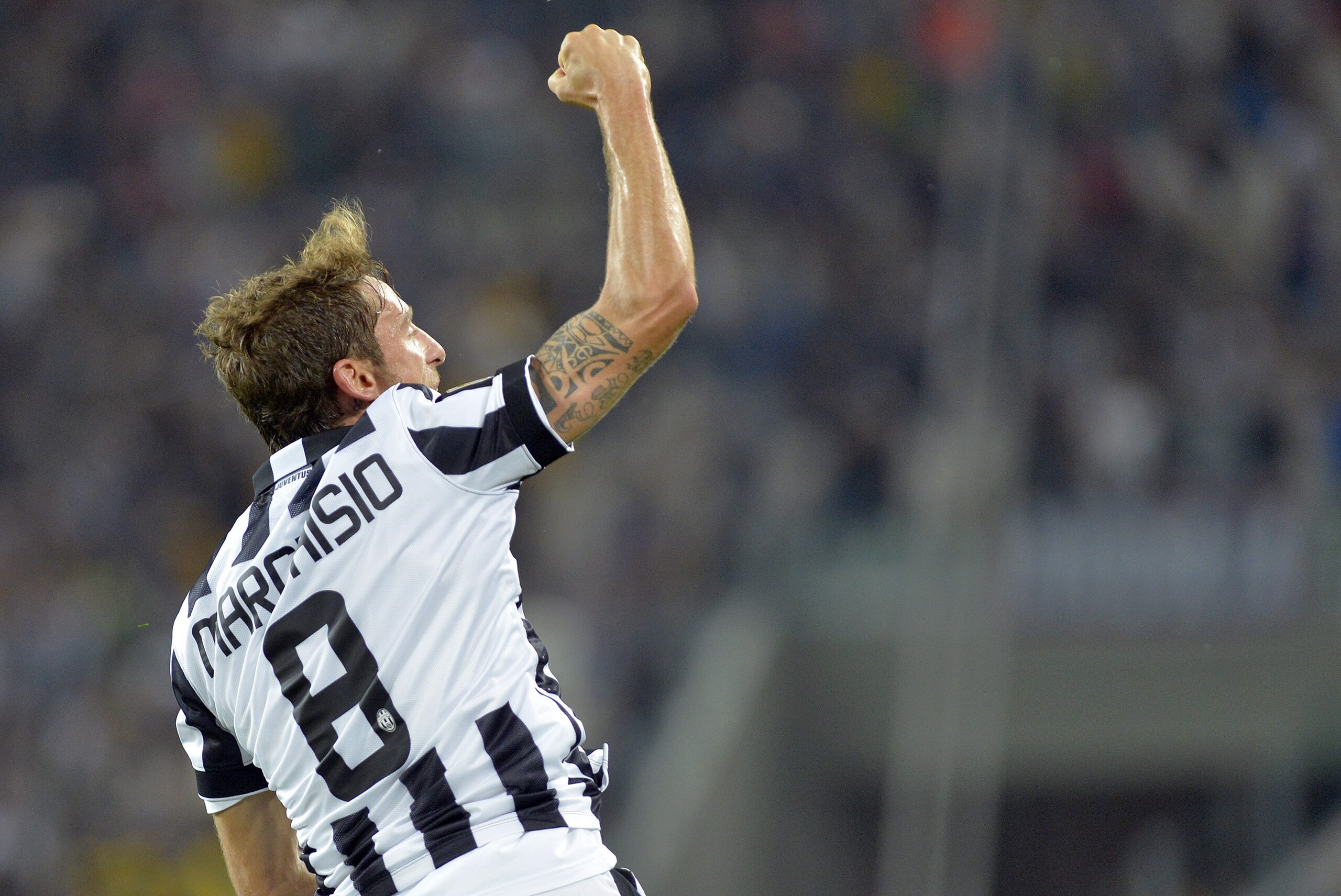 Juventus Claudio Marchisio celebrates after scoring his side's second goal, during a Serie A soccer match between Juventus and  Udinese at the Juventus stadium, in Turin, Italy, Saturday, Sept. 13, 2014. (AP Photo/ Massimo Pinca)