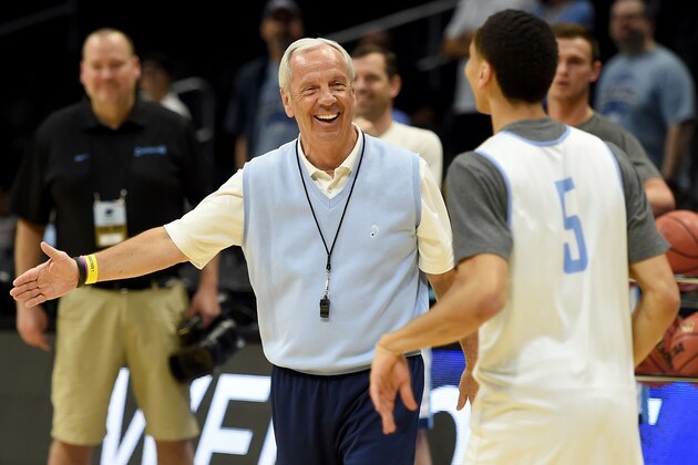 LOS ANGELES, CA - MARCH 25:  Head Coach Roy Williams of the North Carolina Tar Heels laughs with Marcus Paige #5 during practice at Staples Center on March 25, 2015 in Los Angeles, California.  (Photo by Harry How/Getty Images)