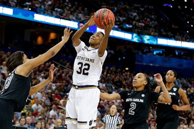 TAMPA, FL - APRIL 05:  Jewell Loyd #32 of the Notre Dame Fighting Irish goes up against Tina Roy #23 of the South Carolina Gamecocks in the second half during the NCAA Women's Final Four Semifinal at Amalie Arena on April 5, 2015 in Tampa, Florida.  (Photo by Mike Carlson/Getty Images)