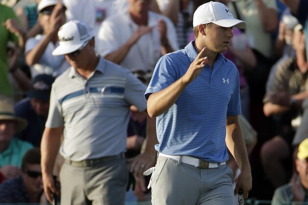 Jordan Spieth waves after putting out on the 18th hole during the third round of the Masters golf tournament Saturday, April 11, 2015, in Augusta, Ga. (AP Photo/Charlie Riedel)
