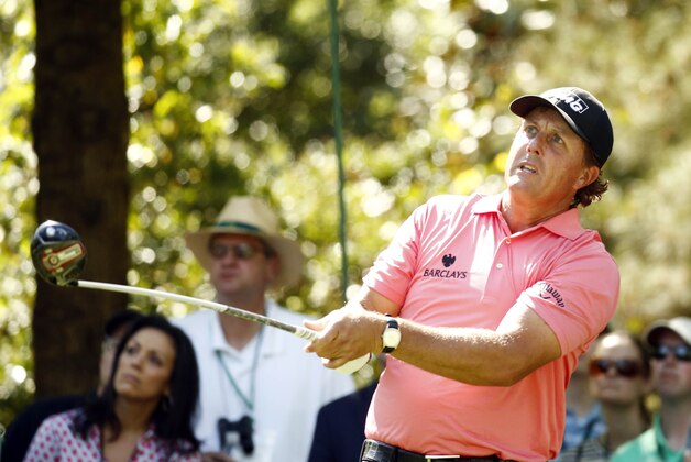Apr 11, 2015; Augusta, GA, USA; Phil Mickelson hits his tee shot on the 7th hole during the third round of The Masters golf tournament at Augusta National Golf Club. Mandatory Credit: Rob Schumacher-USA TODAY Sports