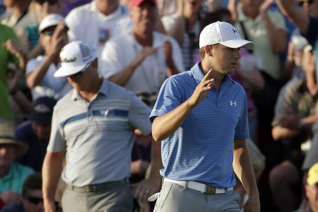 Jordan Spieth waves after putting out on the 18th hole during the third round of the Masters golf tournament Saturday, April 11, 2015, in Augusta, Ga. (AP Photo/Charlie Riedel)