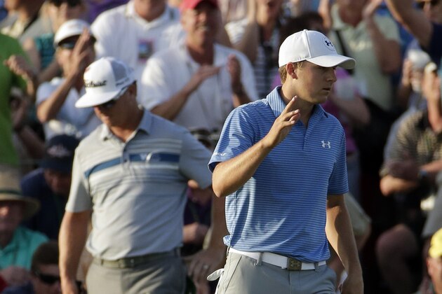 Jordan Spieth waves after putting out on the 18th hole during the third round of the Masters golf tournament Saturday, April 11, 2015, in Augusta, Ga. (AP Photo/Charlie Riedel)